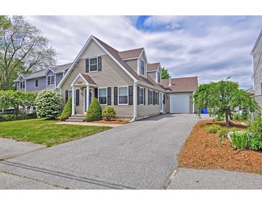22 Riverside Street Danvers, MA 01923 - Photo 3 of 20 a front view of a house with a yard and garage