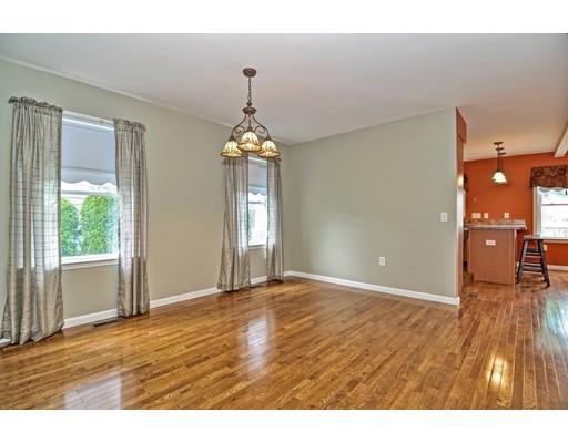 22 Riverside Street Danvers, MA 01923 - Photo 10 of 20 a view of an empty room with window and wooden floor