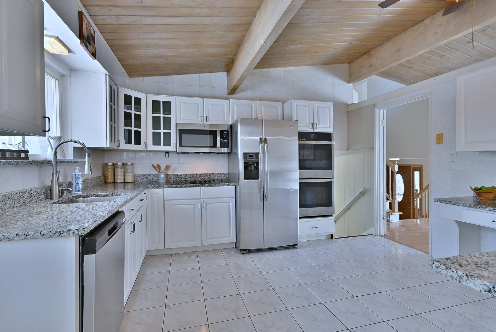 521 Michael Manor Glenview, IL 60025 - Photo 13 of 52 a kitchen with kitchen island granite countertop a stove sink and refrigerator