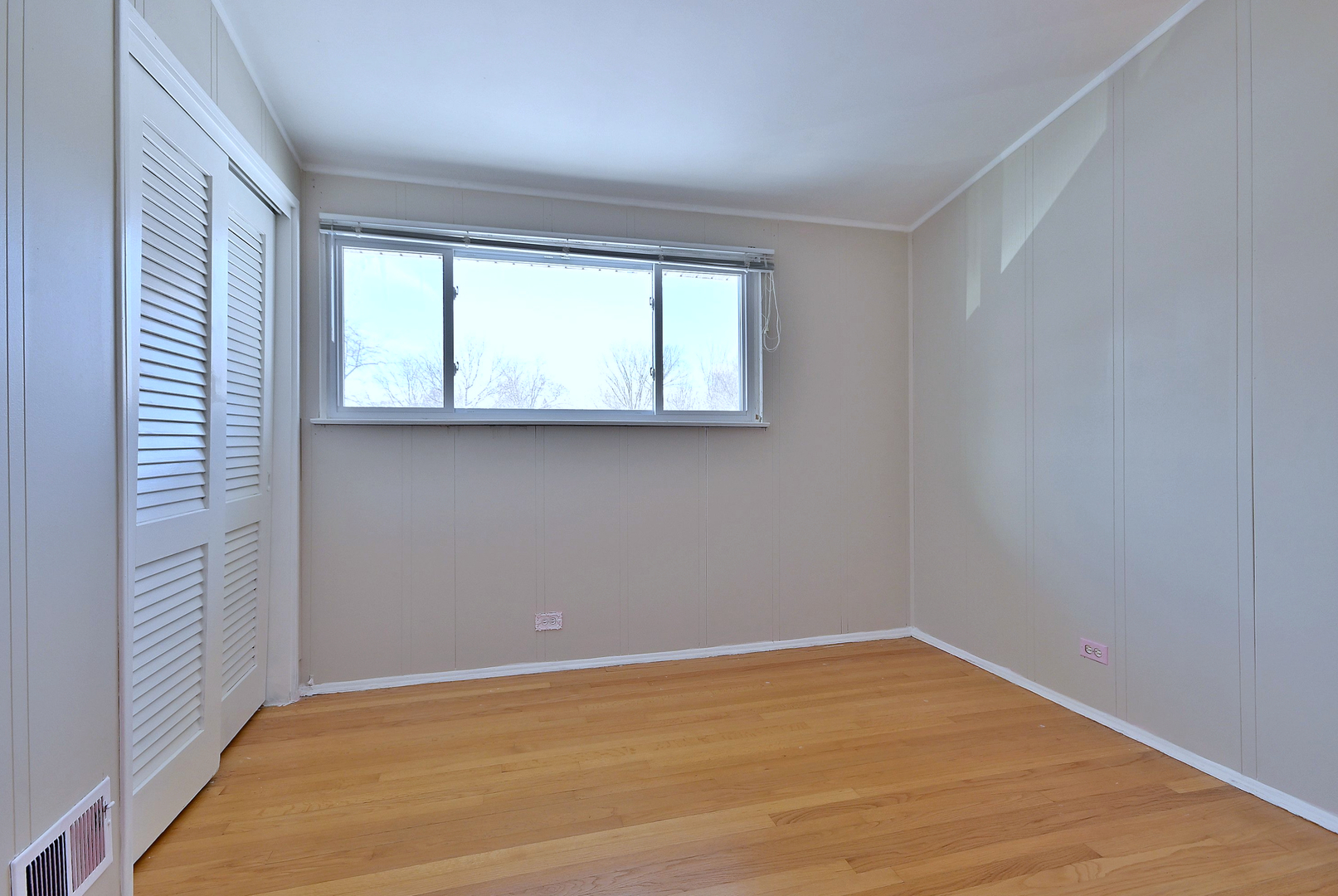 521 Michael Manor Glenview, IL 60025 - Photo 20 of 52 wooden floor in an empty room with a window