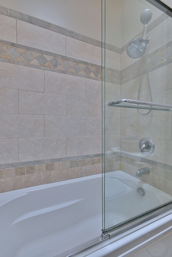 521 Michael Manor Glenview, IL 60025 - Photo 28 of 52 a bathroom with a bathtub and a shower