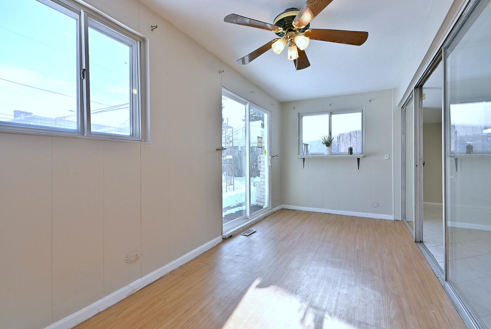 521 Michael Manor Glenview, IL 60025 - Photo 33 of 52 a view of empty room with wooden floor and fan