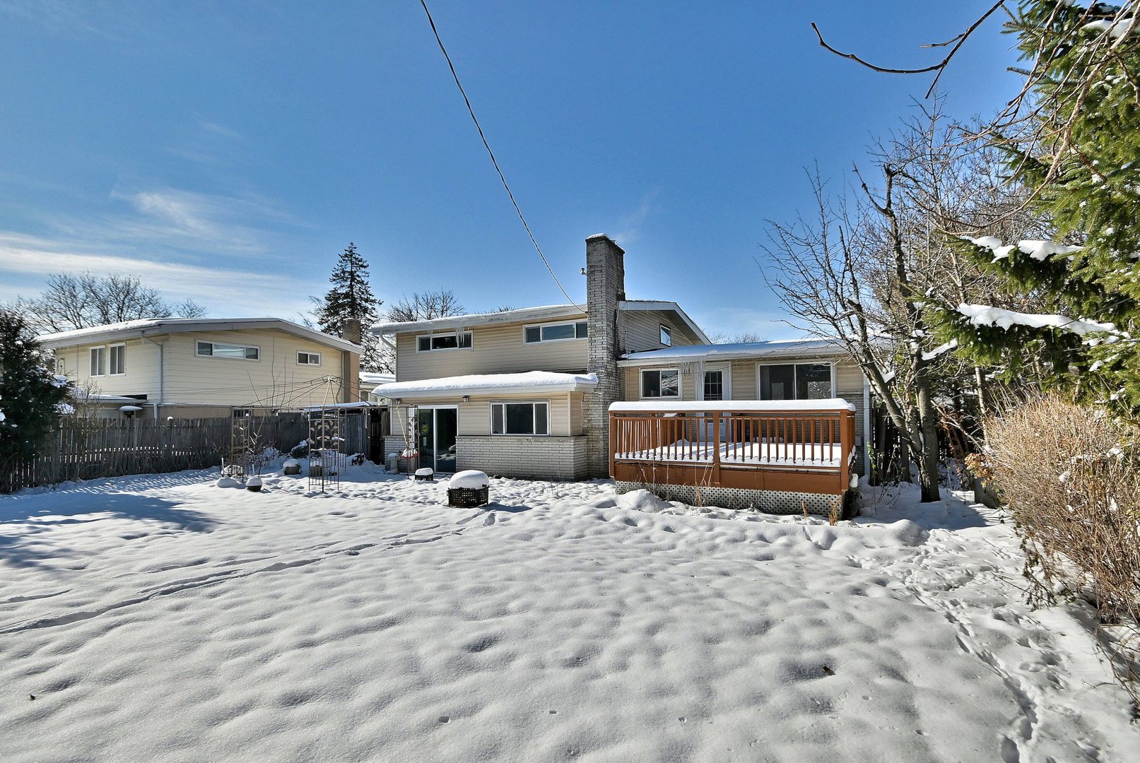 521 Michael Manor Glenview, IL 60025 - Photo 47 of 52 a front view of a house with a yard covered in snow