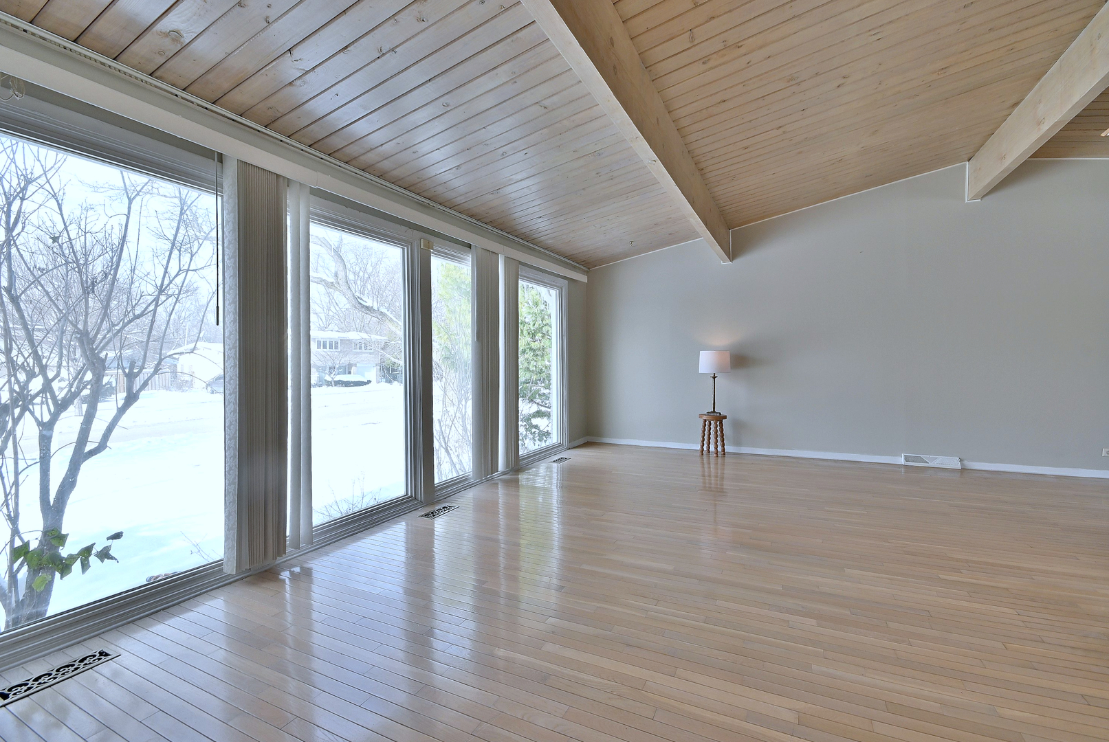 521 Michael Manor Glenview, IL 60025 - Photo 7 of 52 a view of an empty room with wooden floor and a window