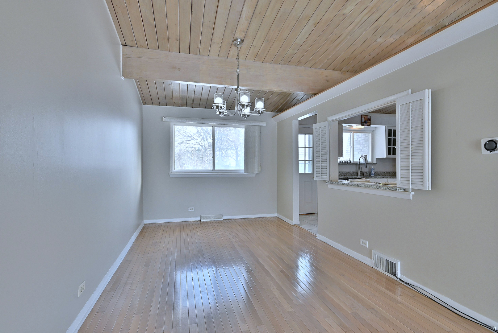 521 Michael Manor Glenview, IL 60025 - Photo 10 of 52 a view of an empty room with wooden floor and a window