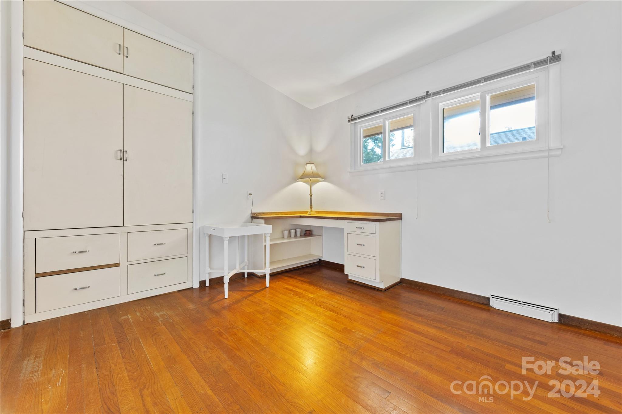 3239 Foxcroft Road Charlotte, NC 28211 - Photo 18 of 42 a bedroom with a bed and a window