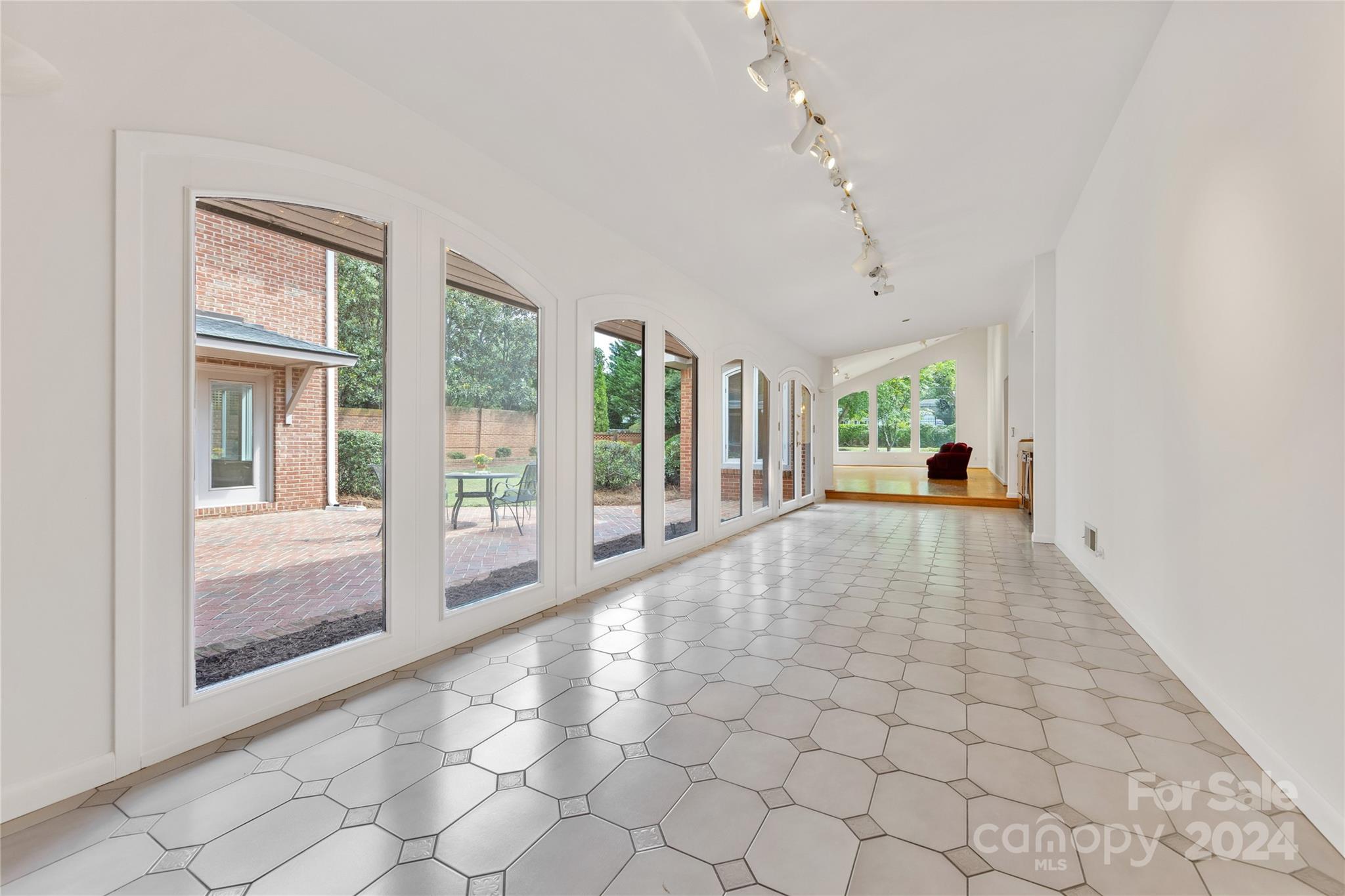 3239 Foxcroft Road Charlotte, NC 28211 - Photo 21 of 42 a view of an entryway with floor to ceiling windows and a livingroom