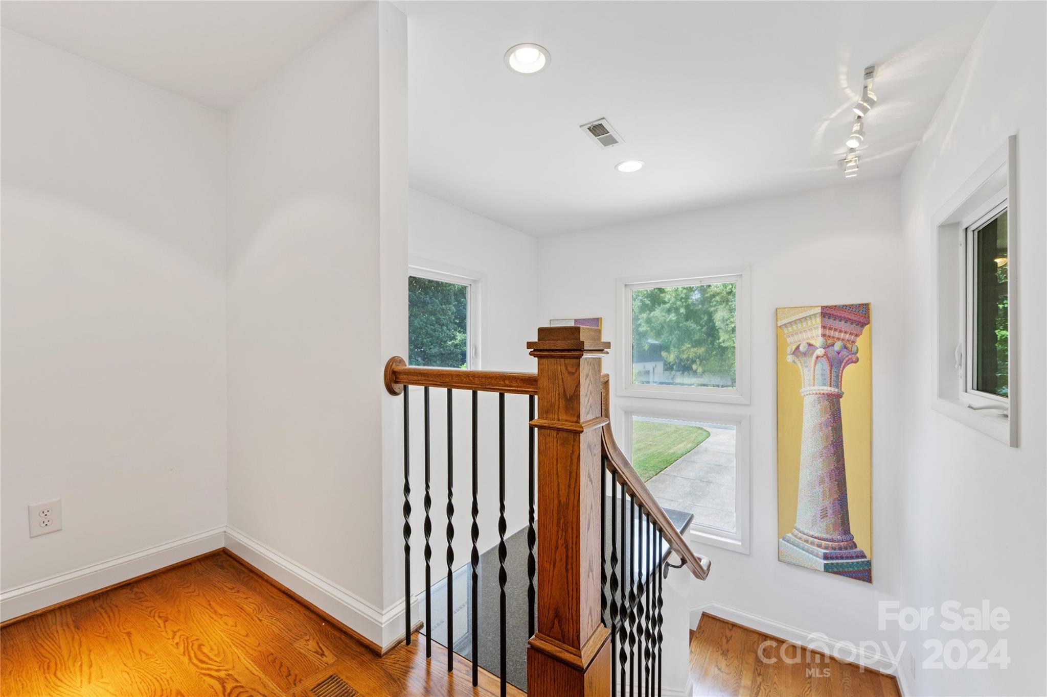 3239 Foxcroft Road Charlotte, NC 28211 - Photo 34 of 42 a view of an entryway with wooden floor and windows