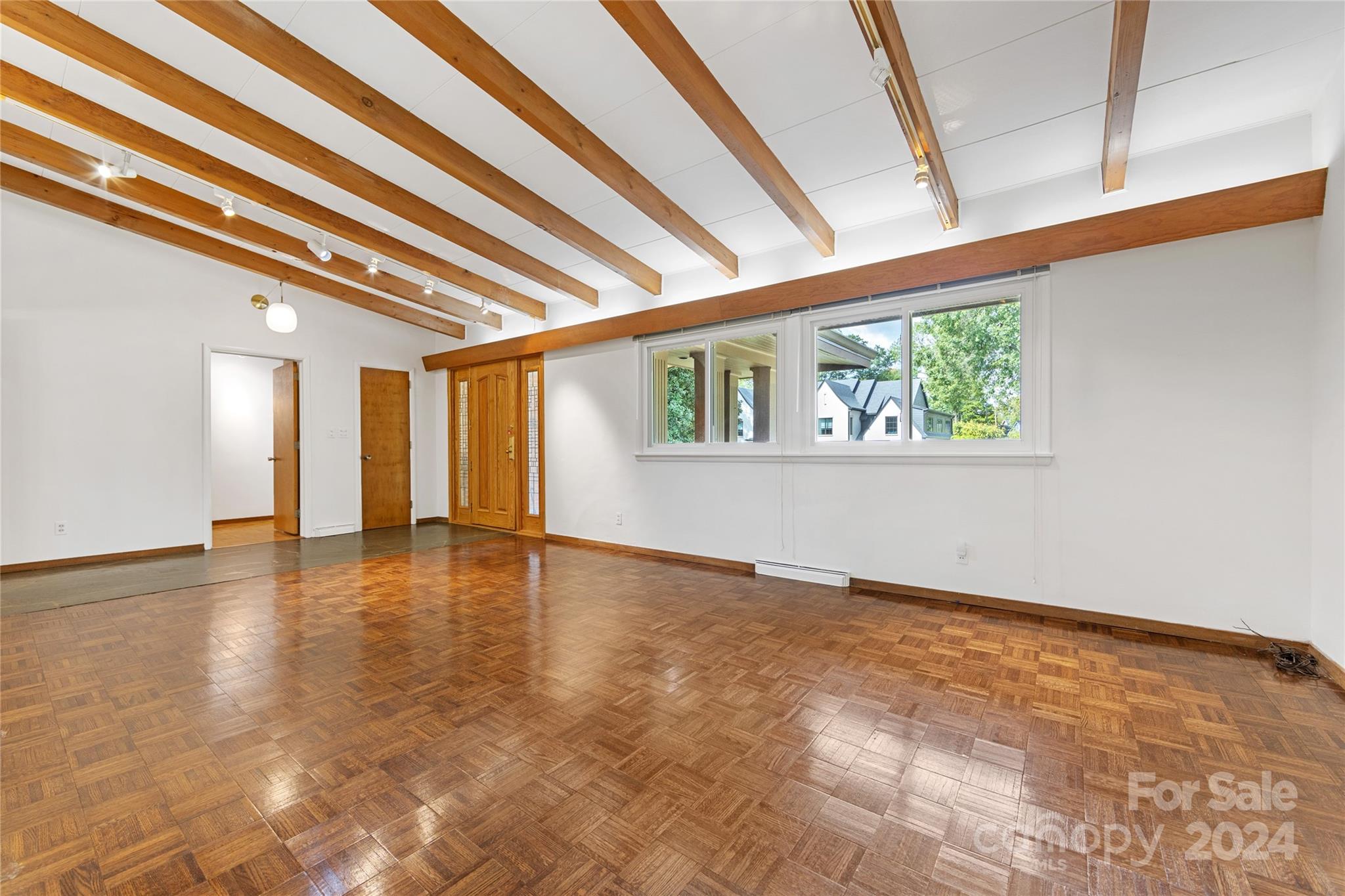 3239 Foxcroft Road Charlotte, NC 28211 - Photo 7 of 42 a view of an empty room with a window