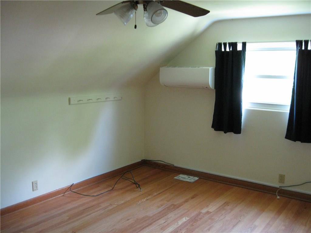 3108 Mercer Road New Castle, PA 16105 - Photo 8 of 17 2nd floor bedroom with hardwood floors and wall air conditioning unit.