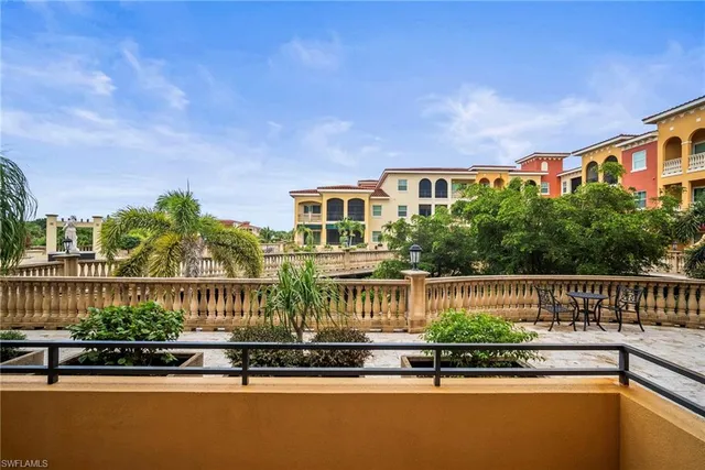 a bedroom with a bed couch and window