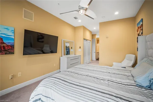 a view of a hallway with closet and a livingroom view