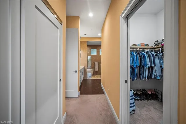 a bathroom with a granite countertop sink a toilet and shower