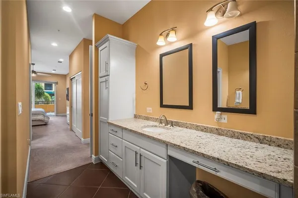 a bedroom with a bed and a table in it