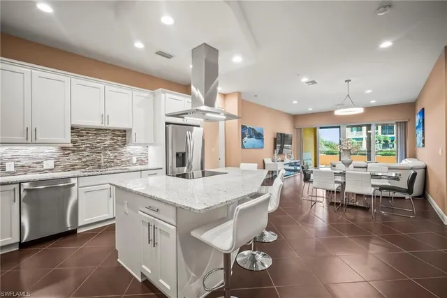 a kitchen with counter space appliances cabinets and furniture