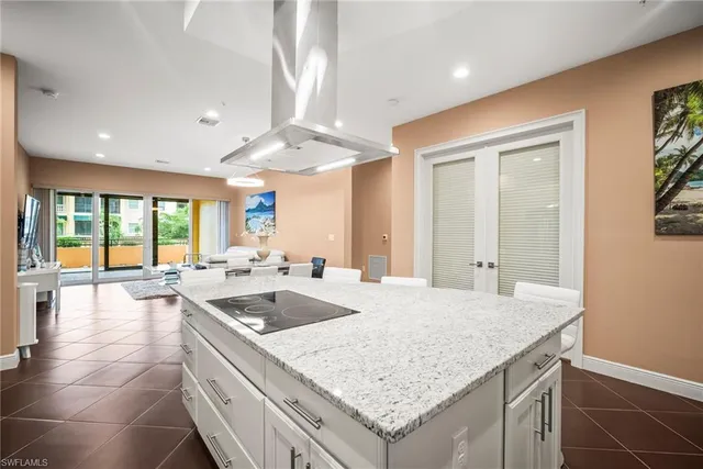a kitchen with a sink and large window