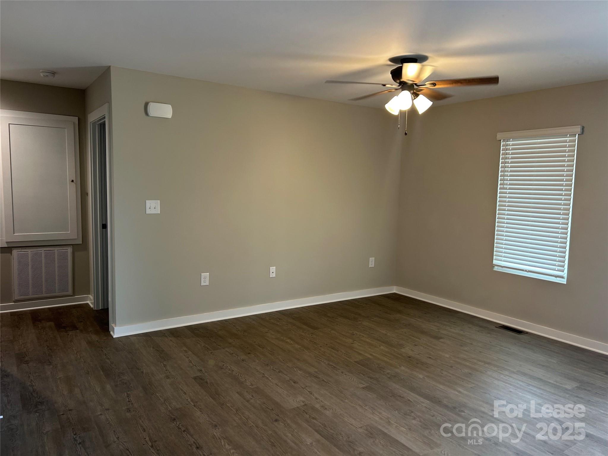 3297 Paul Elmore Road Lincolnton, NC 28092 - Photo 14 of 14 a view of an empty room with wooden floor and a window