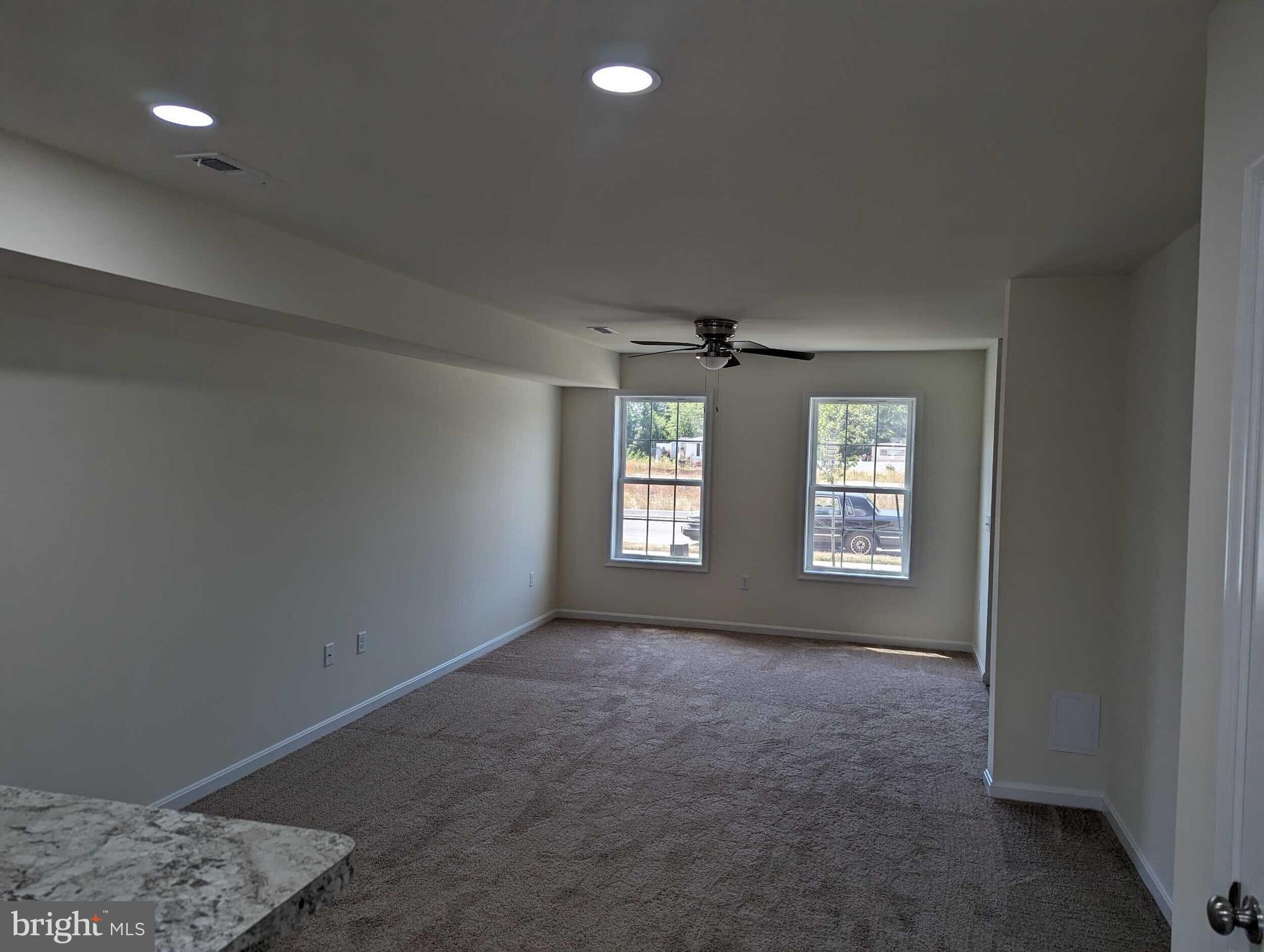 227 Rojan Road Dover, DE 19901 - Photo 4 of 20 a view of an empty room with a window