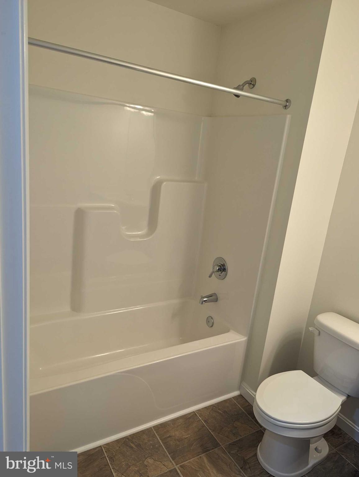 227 Rojan Road Dover, DE 19901 - Photo 7 of 20 a bathroom with a toilet and a bathtub