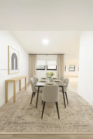 a work room with furniture and a wooden floor