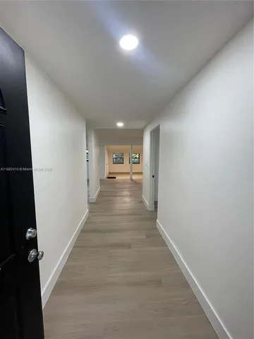 a view of entryway with wooden floor