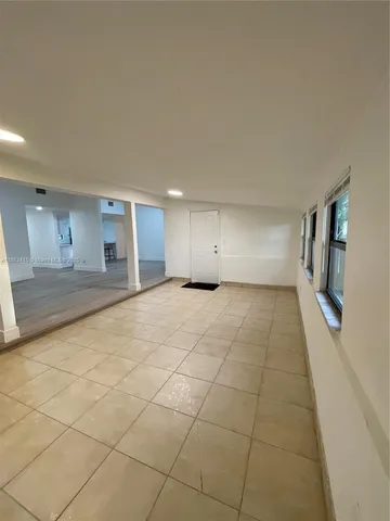 a view of an empty room with a fireplace