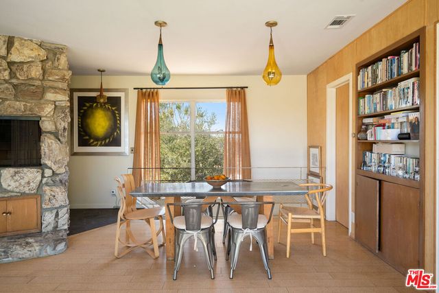 a view of a dining room with furniture window and outside view