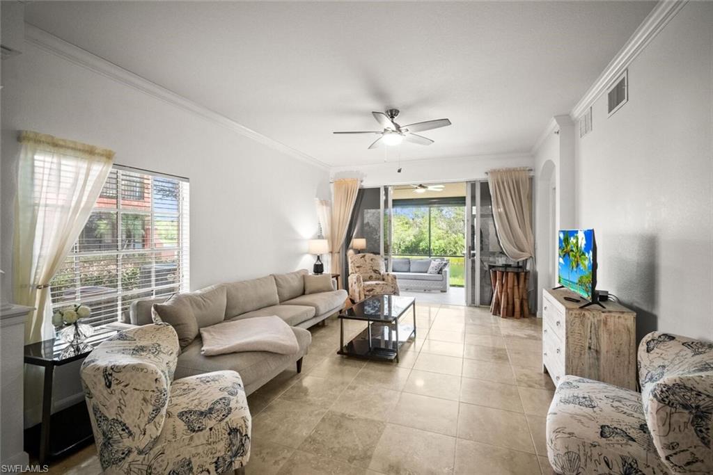8701 Piazza Del Lago Circle, Unit 101 Estero, FL 33928 - Photo 11 of 50 a living room with furniture and a window