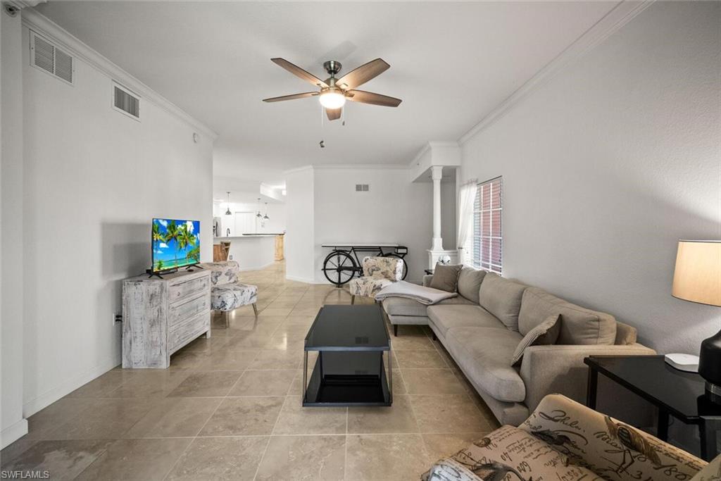 8701 Piazza Del Lago Circle, Unit 101 Estero, FL 33928 - Photo 12 of 50 a living room with furniture and a wooden floor