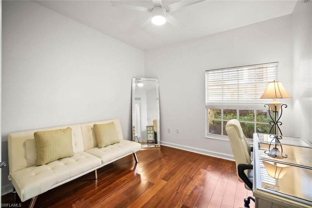 8701 Piazza Del Lago Circle, Unit 101 Estero, FL 33928 - Photo 34 of 50 a living room with furniture and a large window