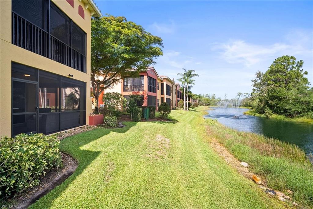 8701 Piazza Del Lago Circle, Unit 101 Estero, FL 33928 - Photo 36 of 50 a view of a house with a yard