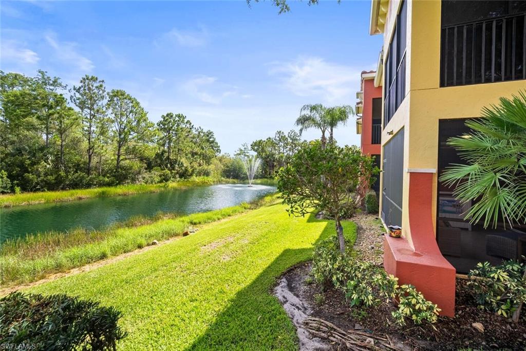 8701 Piazza Del Lago Circle, Unit 101 Estero, FL 33928 - Photo 37 of 50 a view of a lake with a house in the background