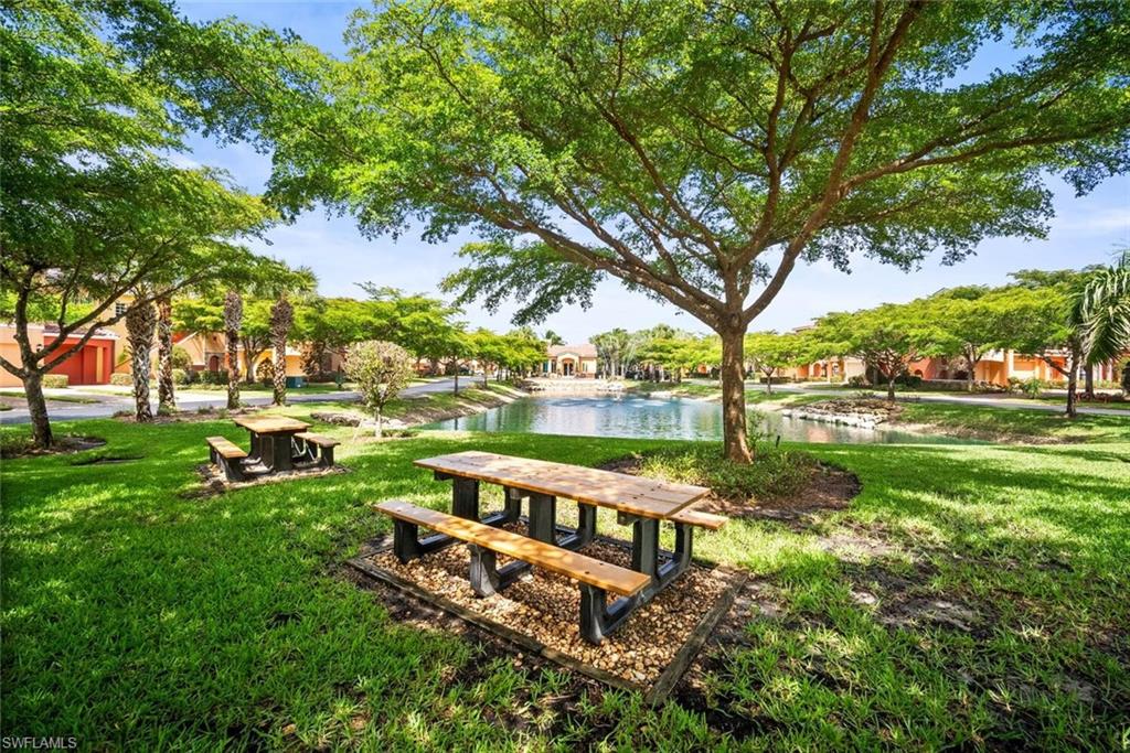 8701 Piazza Del Lago Circle, Unit 101 Estero, FL 33928 - Photo 41 of 50 a view of a park with large trees