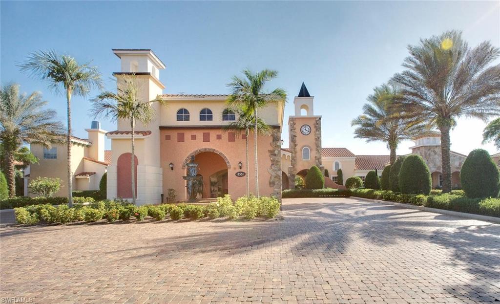 8701 Piazza Del Lago Circle, Unit 101 Estero, FL 33928 - Photo 44 of 50 a front view of multiple houses with yard