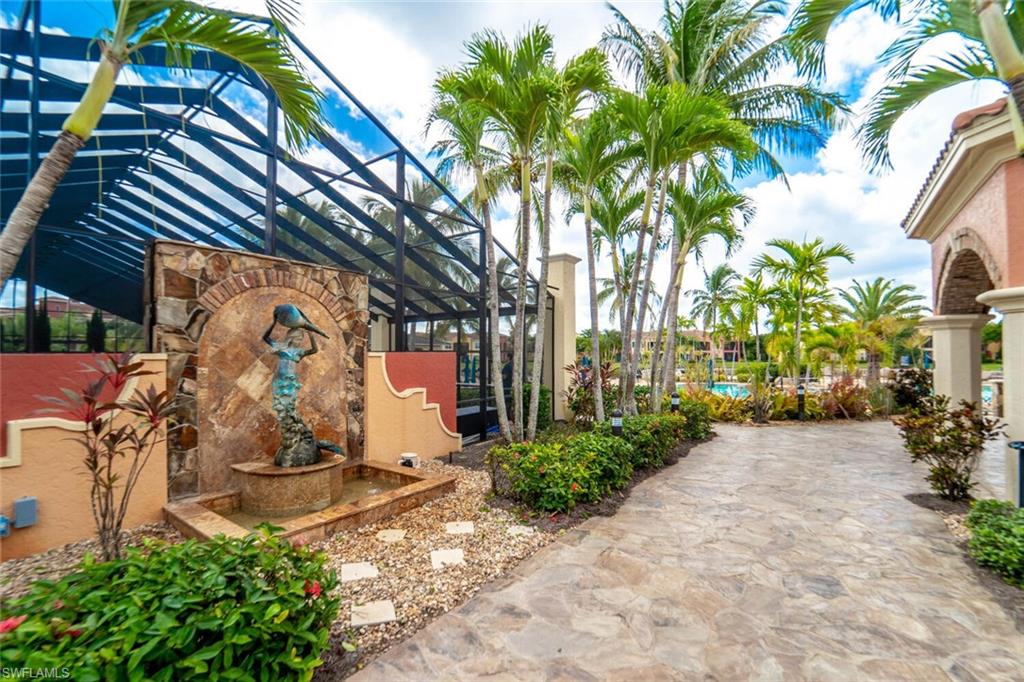 8701 Piazza Del Lago Circle, Unit 101 Estero, FL 33928 - Photo 45 of 50 a backyard of a house with lots of green space