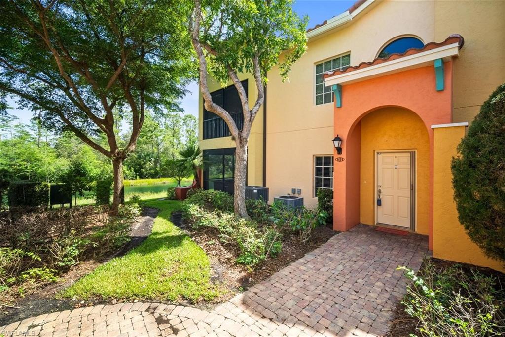 8701 Piazza Del Lago Circle, Unit 101 Estero, FL 33928 - Photo 8 of 50 a front view of a house with garden