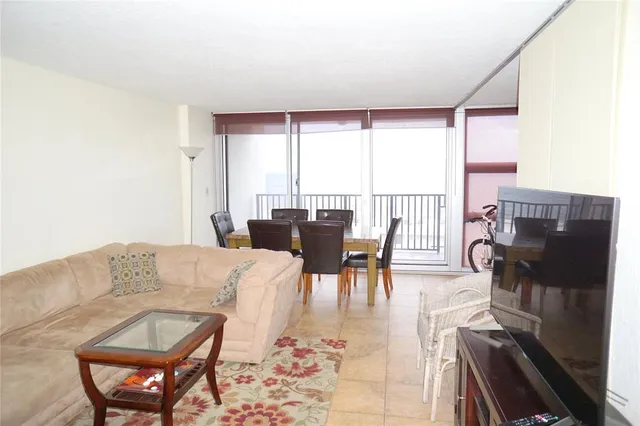 a bedroom with a bed and flat screen tv
