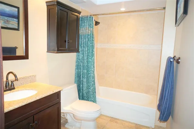 a bathroom with a shower and a toilet
