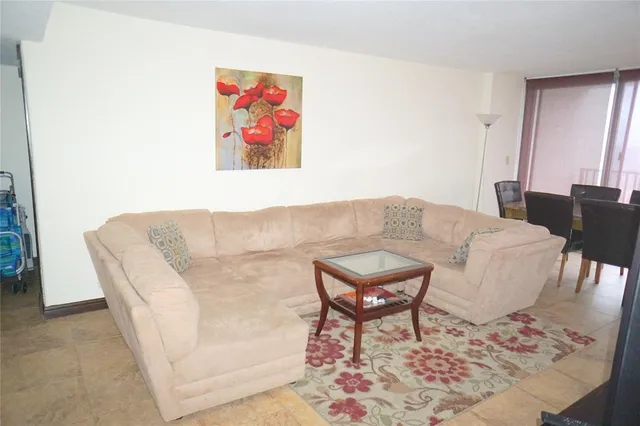 a living room with furniture and a window