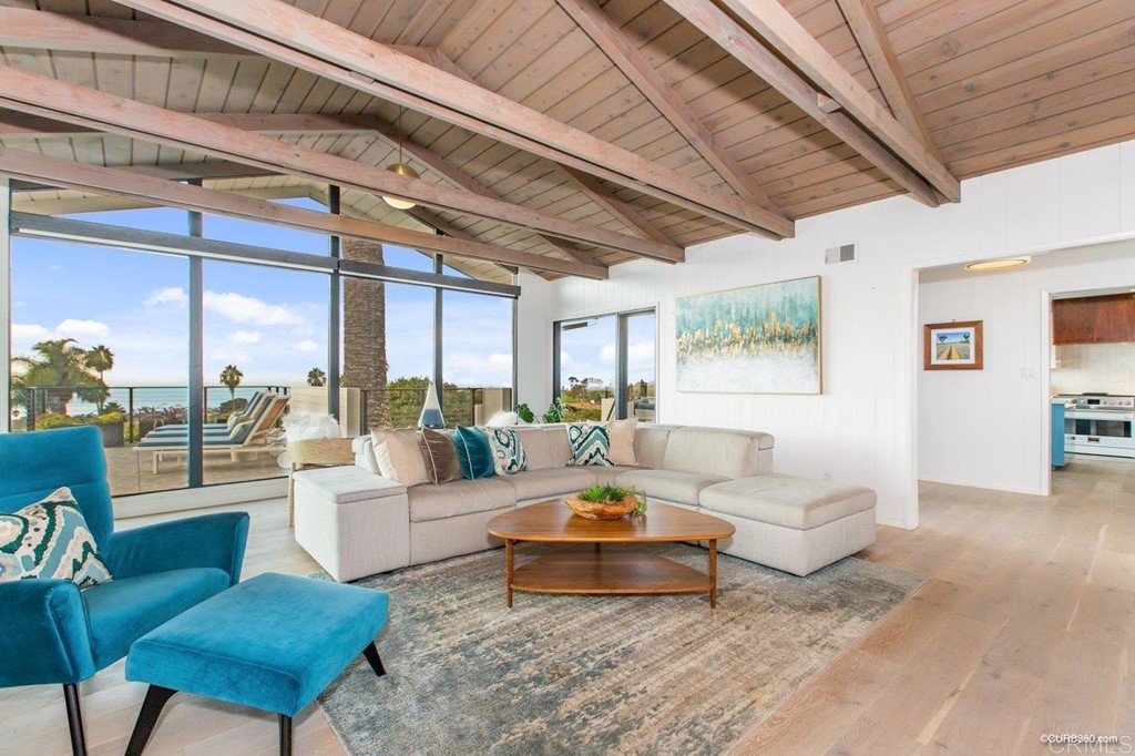 1237 Muirlands Vista Way La Jolla, CA 92037 - Photo 17 of 25 a living room with furniture and a large window