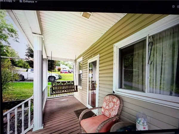 a view of a porch with furniture