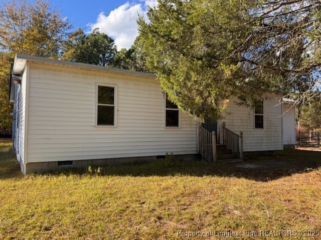 3156 Reservation Road Aberdeen, NC 28315 - Photo 2 of 15 a view of a house with a yard