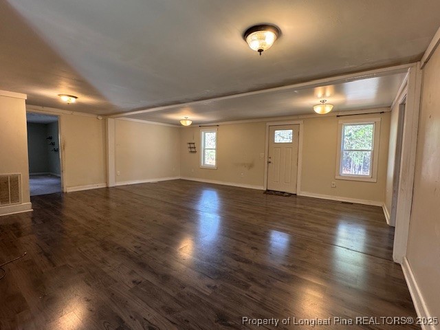 3156 Reservation Road Aberdeen, NC 28315 - Photo 4 of 15 an empty room with wooden floor and windows