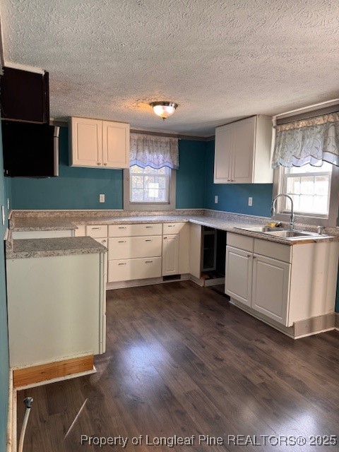 3156 Reservation Road Aberdeen, NC 28315 - Photo 5 of 15 a kitchen with white cabinets and white appliances