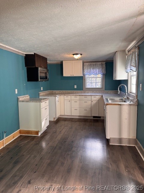 3156 Reservation Road Aberdeen, NC 28315 - Photo 6 of 15 a kitchen with stainless steel appliances wooden floors and view living room