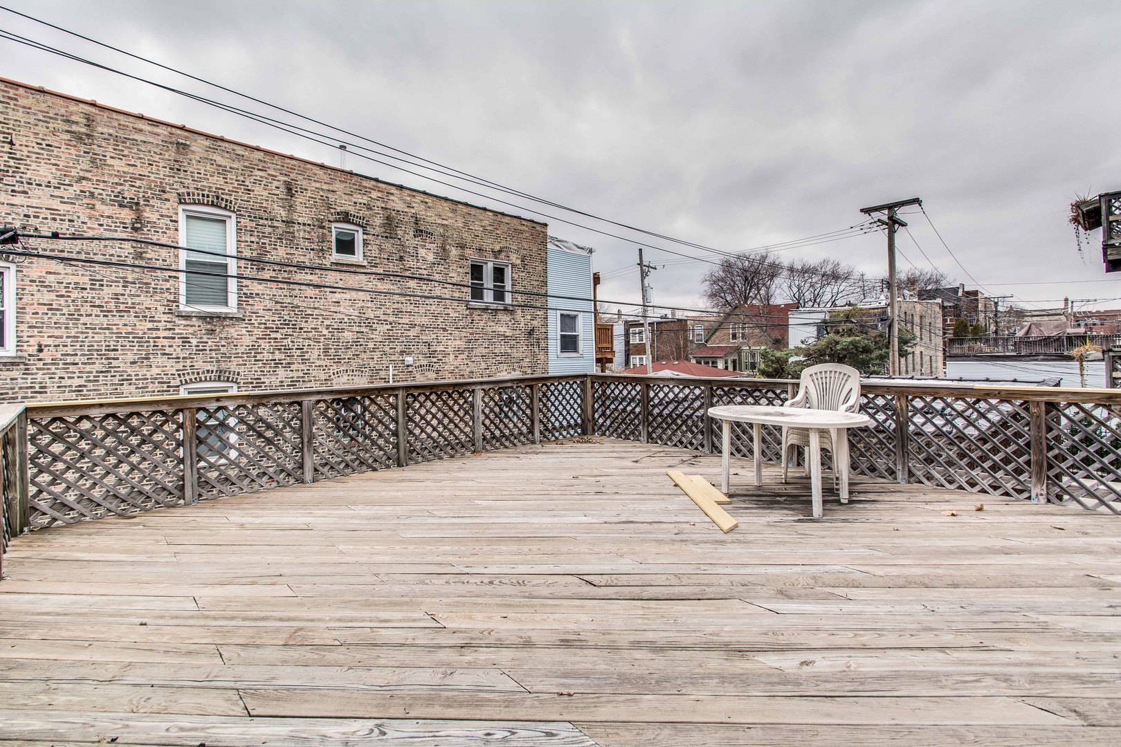 2905 West Logan Boulevard Chicago, IL 60647 - Photo 36 of 36 a roof deck with a chair and table