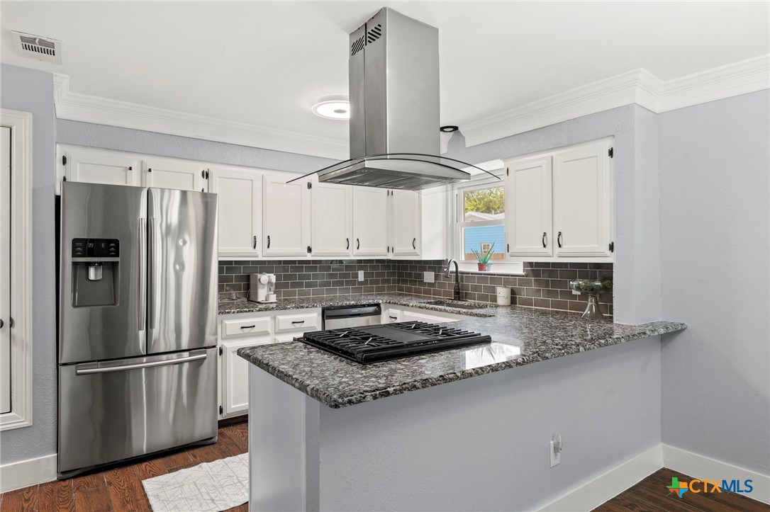 1602 Provident Lane Round Rock, TX 78664 - Photo 2 of 28 The updated kitchen has granite countertops, stainless steel appliances & gas cooktop