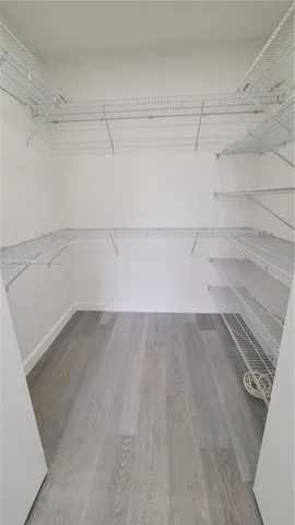 a view of a room with racks on the wall