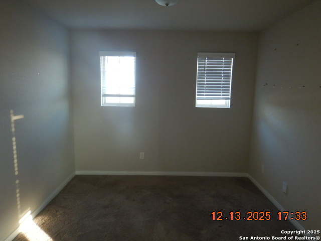 3206 Junction Bay Converse, TX 78109 - Photo 14 of 20 an empty room with wooden floor and windows