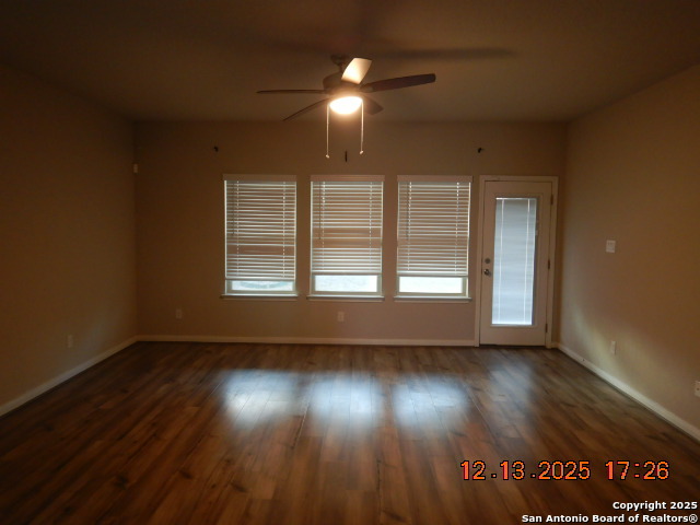 3206 Junction Bay Converse, TX 78109 - Photo 4 of 20 an empty room with wooden floor and windows